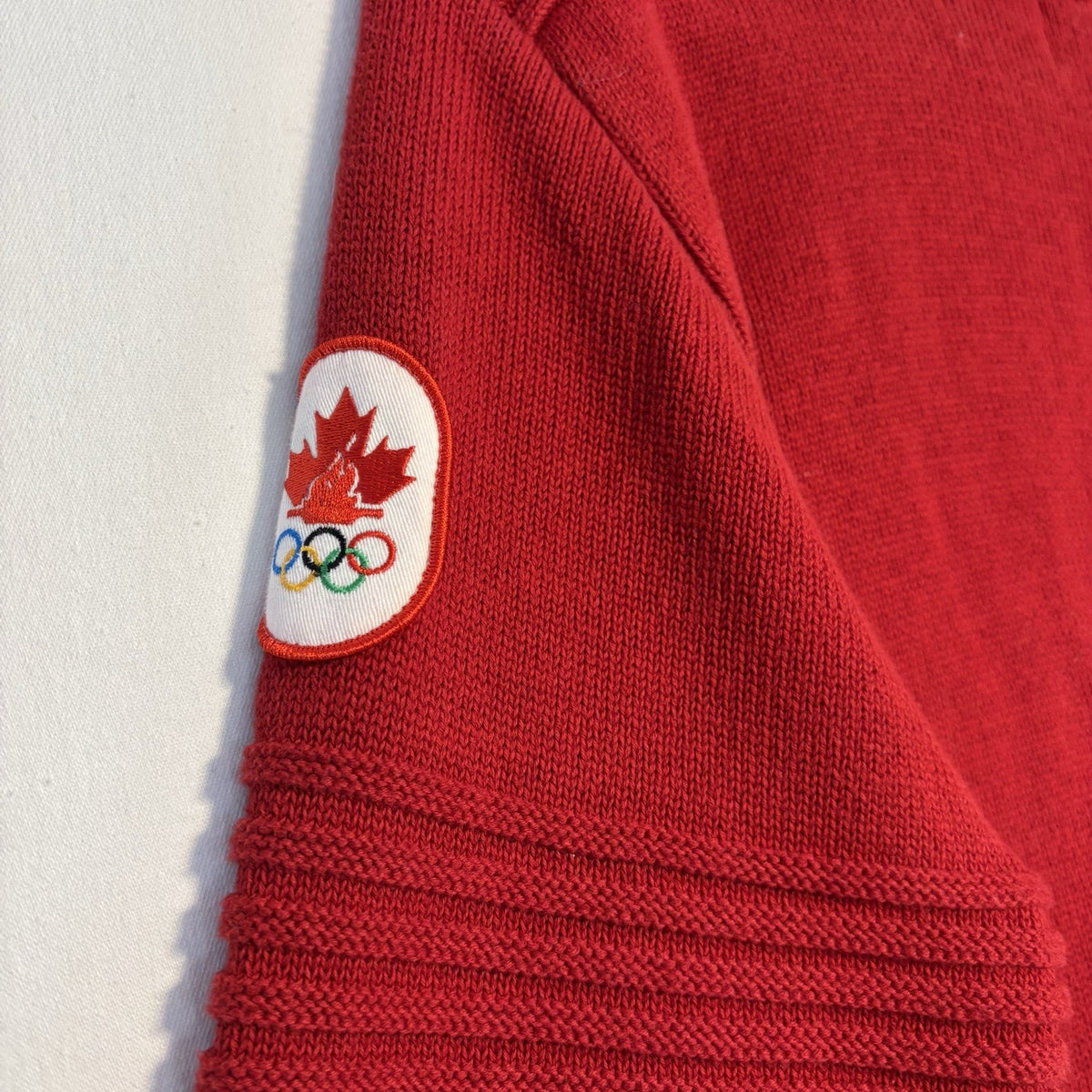 Hudson's Bay Team Canada Red Knit Sweater: Maple leaf sleeve patch close-up