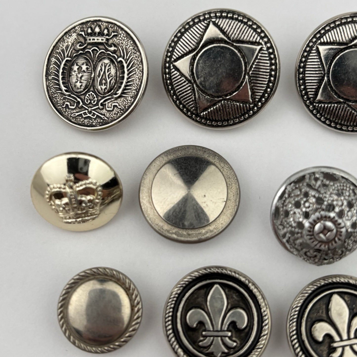 Vintage Silver Crest Button Lot – Fleur-de-Lis, Maple Leaf, Crown & Star, 15pcs