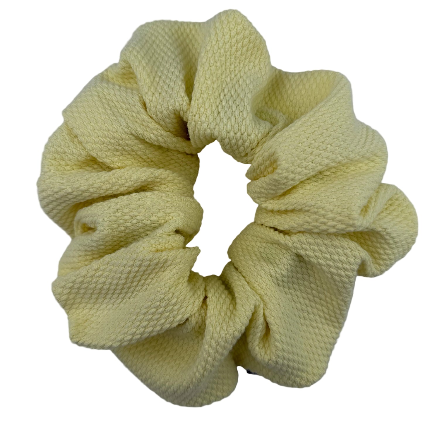 Yellow scrunchie on a white background