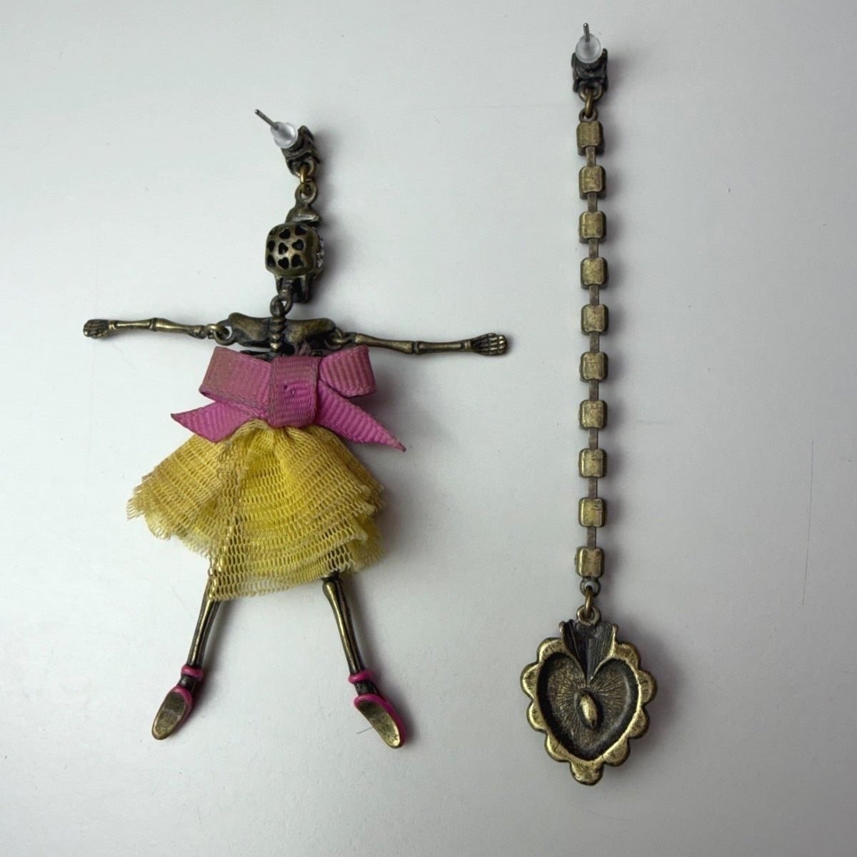 Betsey Johnson skull ballerina and heart earrings — close-up detail
