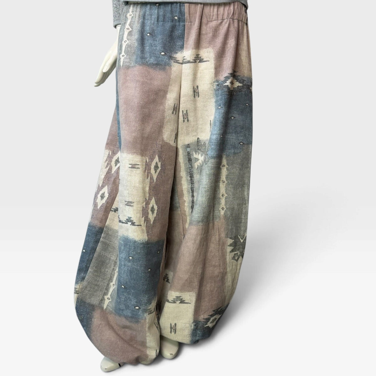 SIMPŁE MAISON one-of-a-kind balloon pants in a muted blue, taupe, and cream geometric print made from reclaimed fabric.