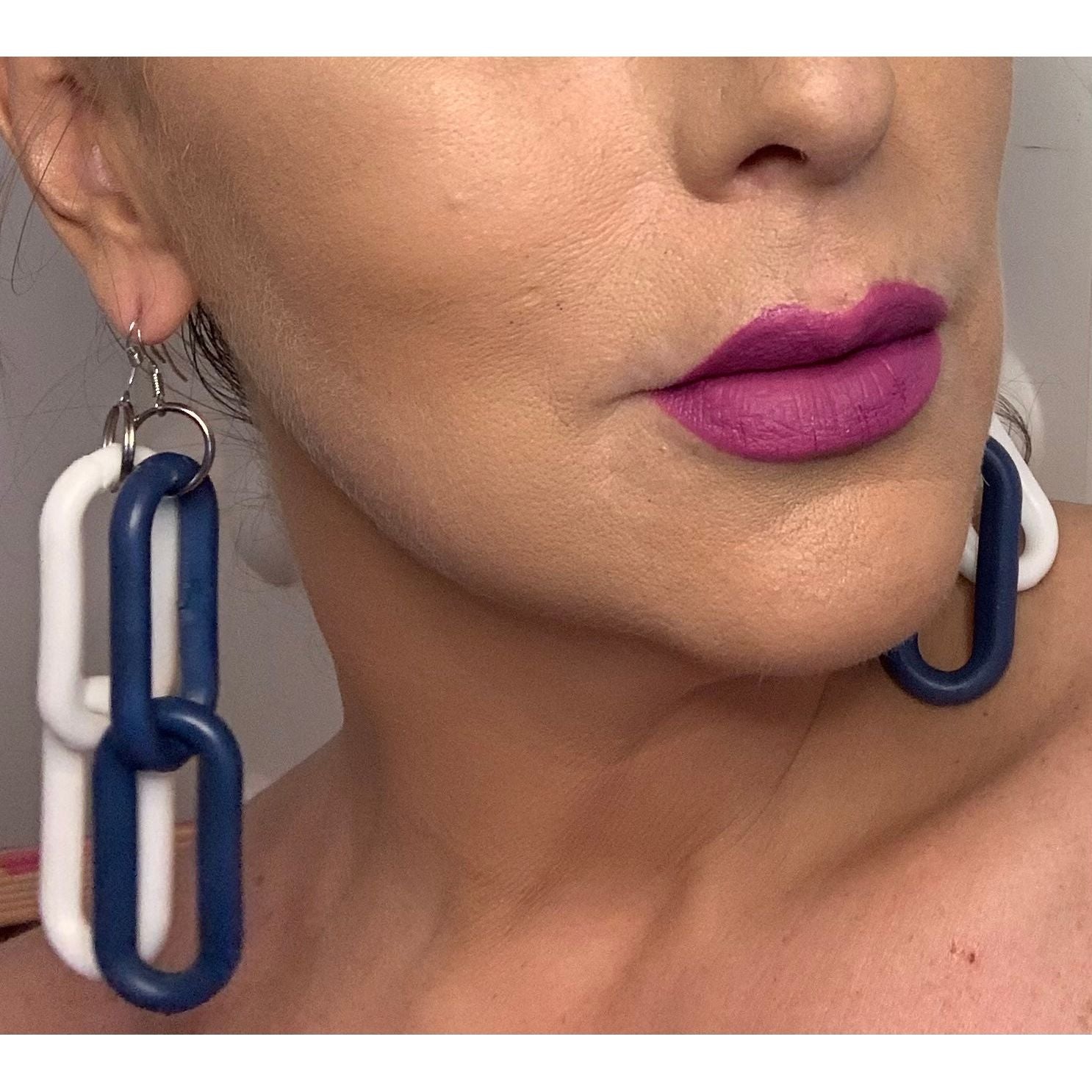 model wearing  double link blue and double link white plastic handmade earrings